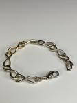 Twisted Link Bracelet, sterling silver w/ 14k gold by Robin Hominiuk